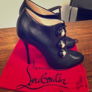 Christian Louboutin booties. Never worn. New.